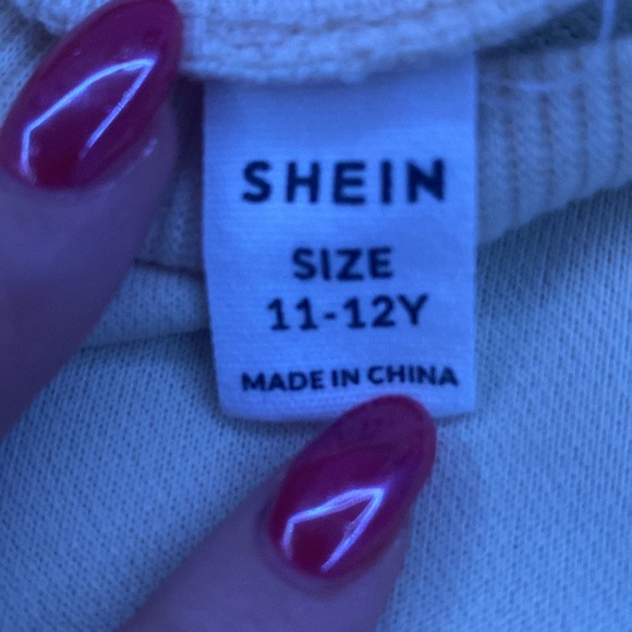 A cream colored sweatshirt from SHEIN with pictures of coffee on the front size - Picture 2 of 3